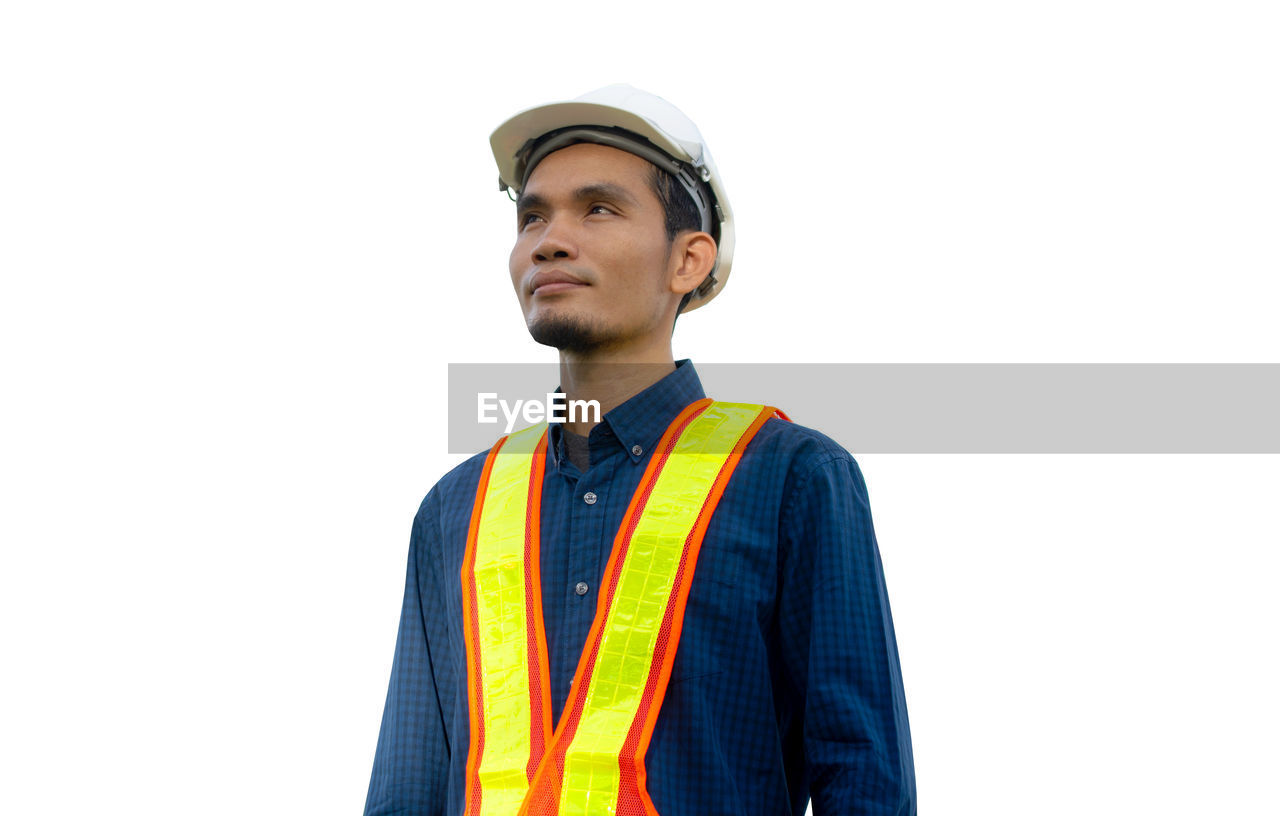 PORTRAIT OF MAN AGAINST WHITE BACKGROUND