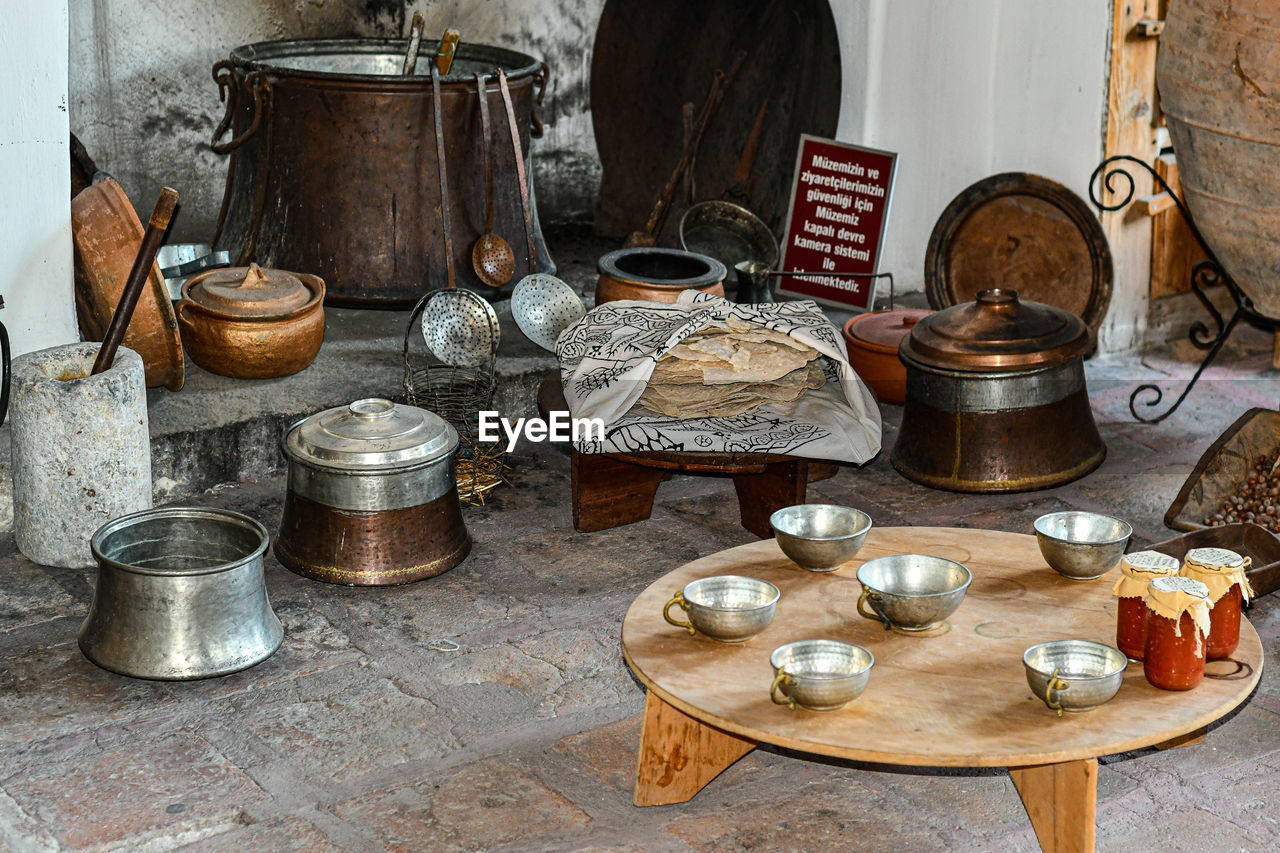 HIGH ANGLE VIEW OF OLD LAMP AND TABLE