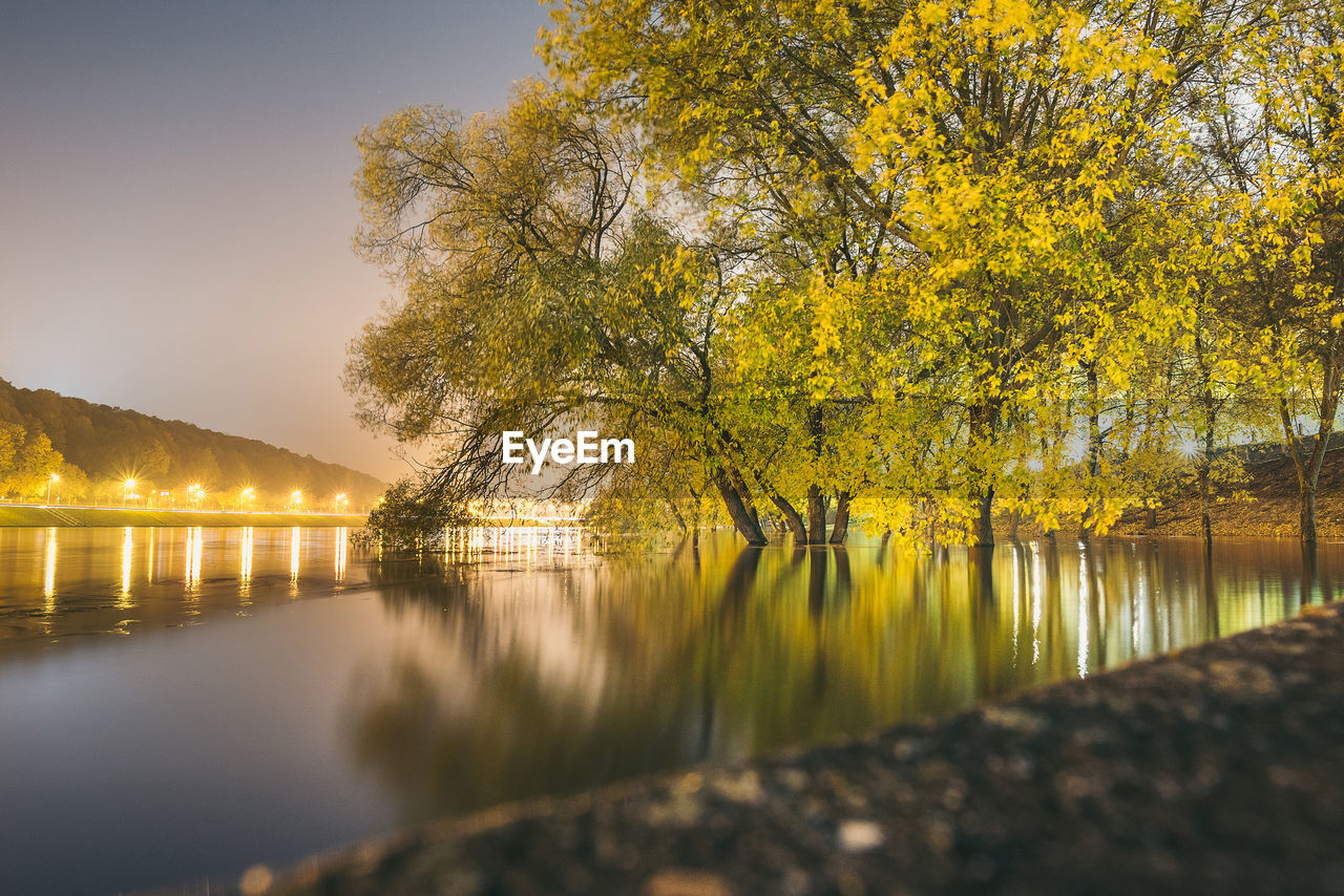 Scenic view of lake against sky during autumn