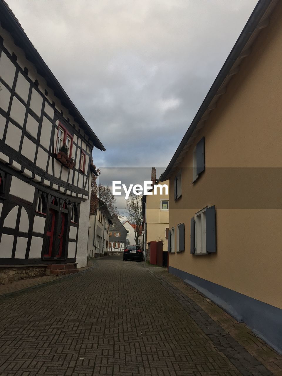 Empty alley amidst buildings in town