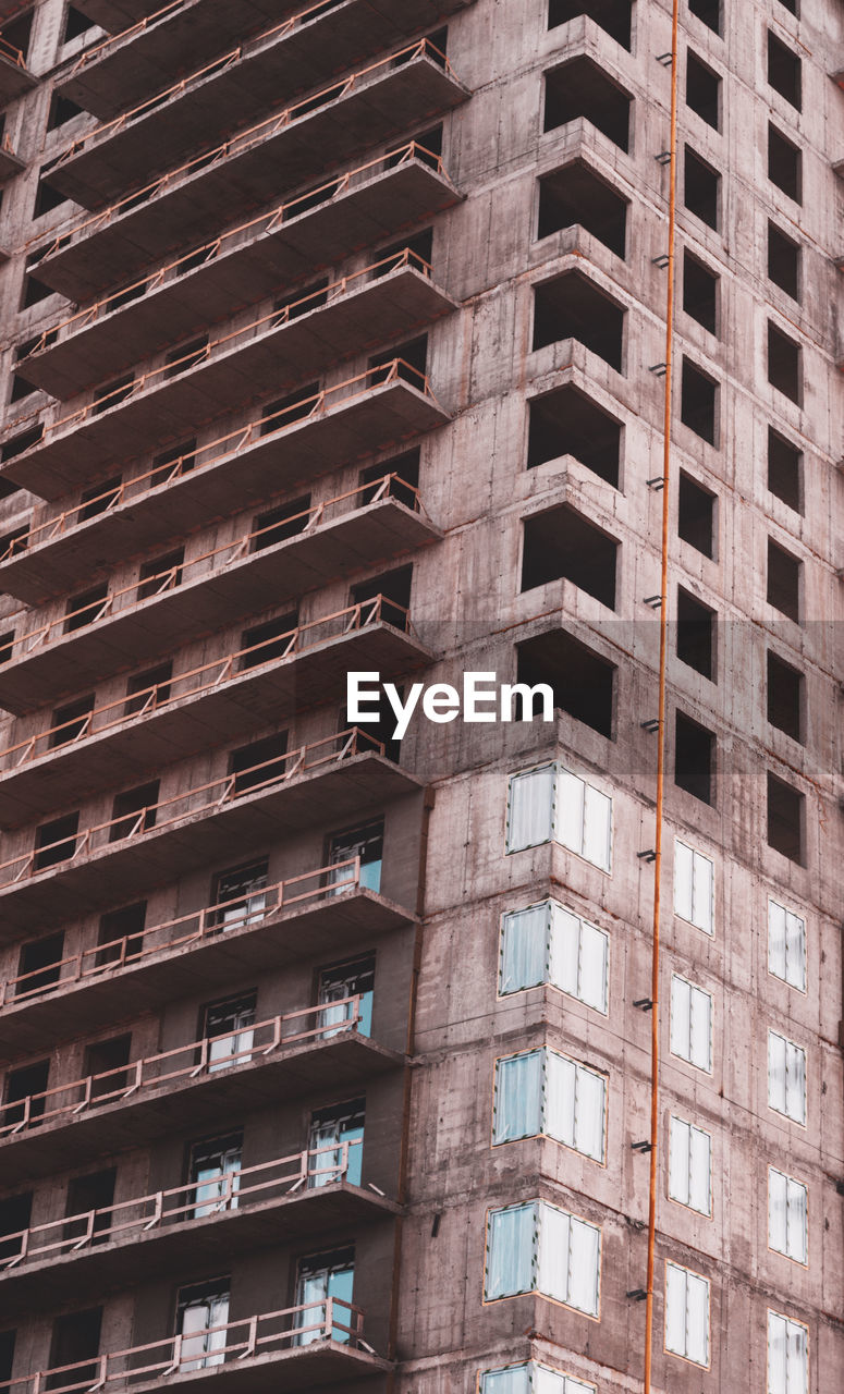 Close-up of a skyscraper with a view of the balconies, modern construction technology