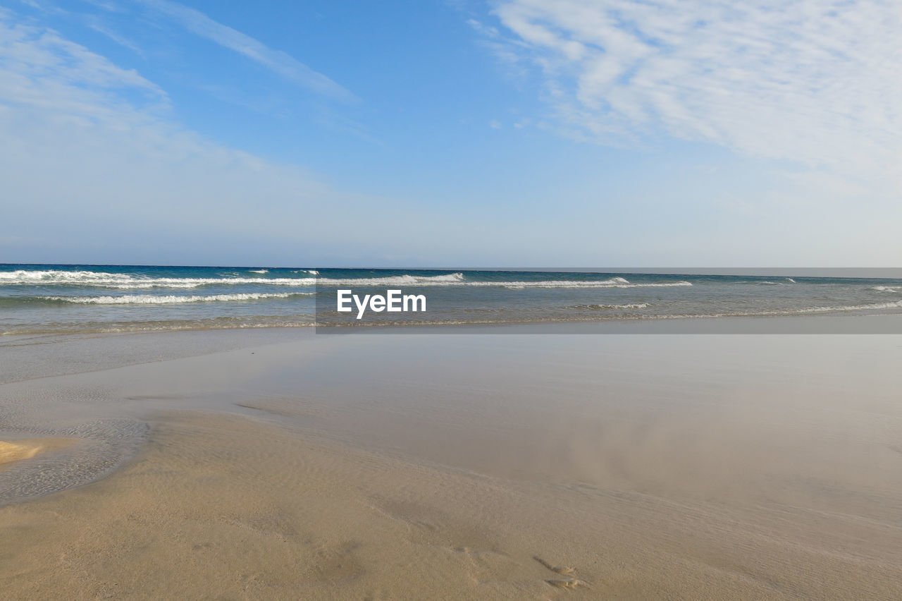 Scenic view of beach against sky