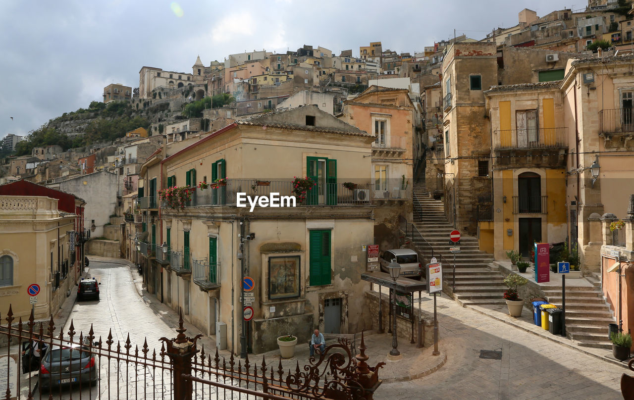 HIGH ANGLE VIEW OF STREET AND BUILDINGS IN TOWN