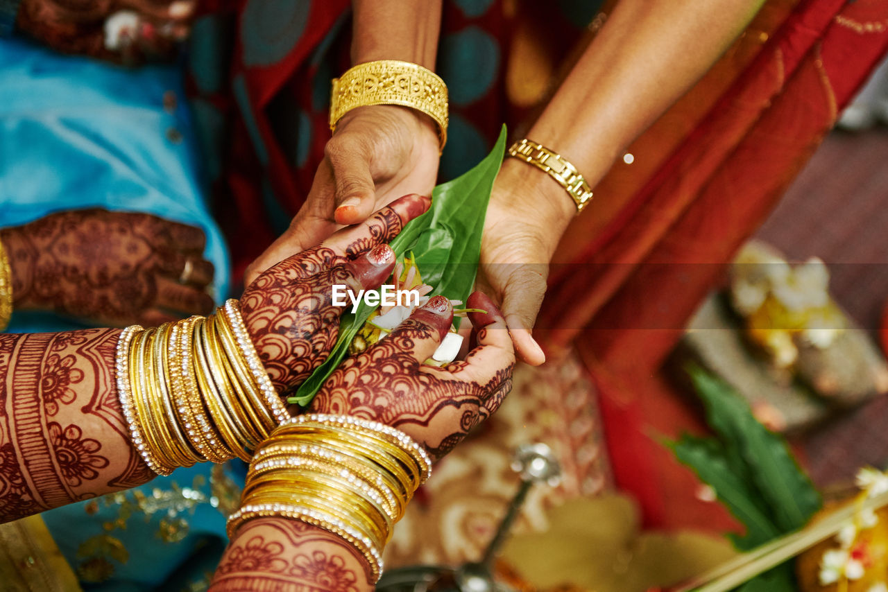 Cropped image of women during wedding ceremony