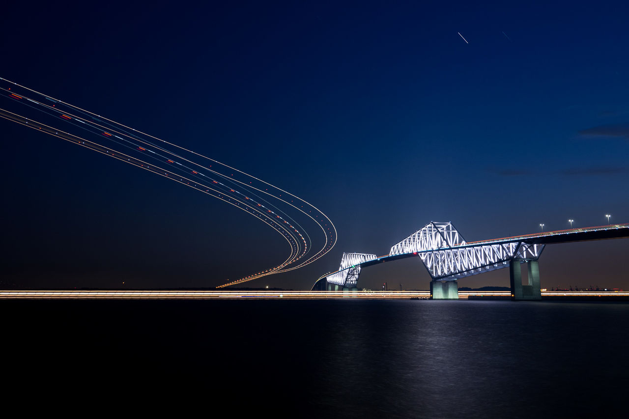 Light trails against sky at night