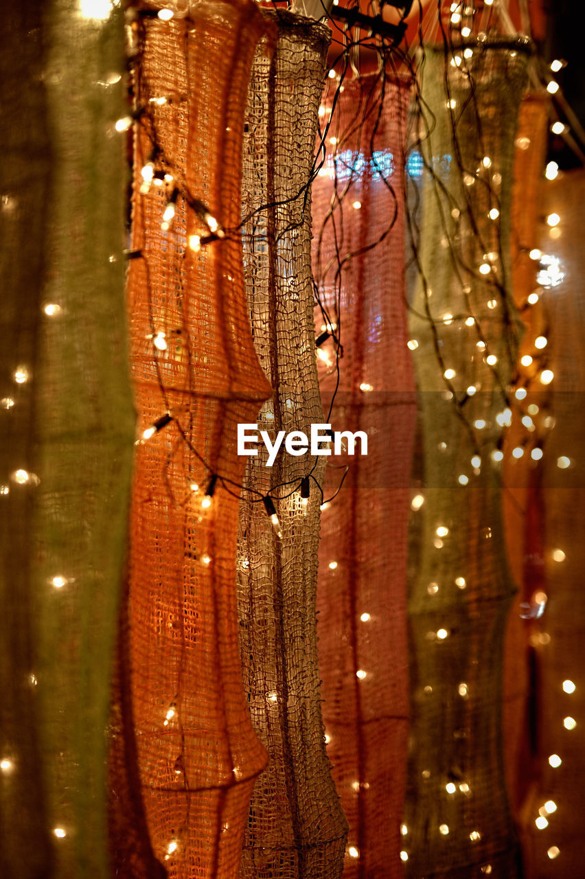 Close-up of christmas decoration hanging at night