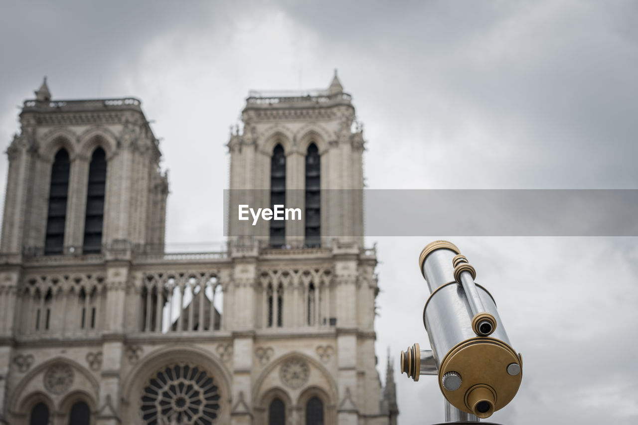 View of notre dame cathedral against cloudy sky