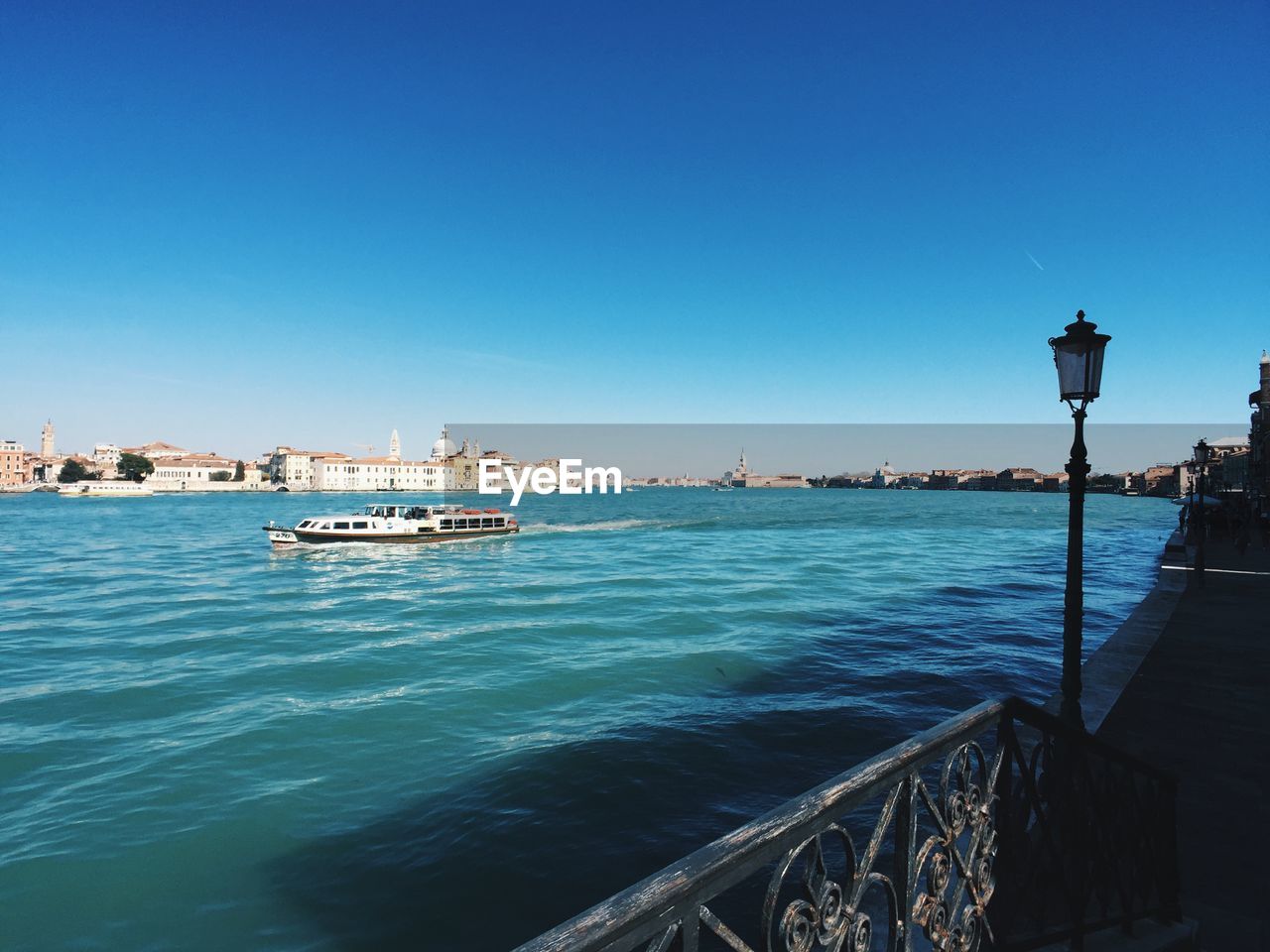 Venice city skyline and giudecca canal on a sunny day, clear and blue sky 