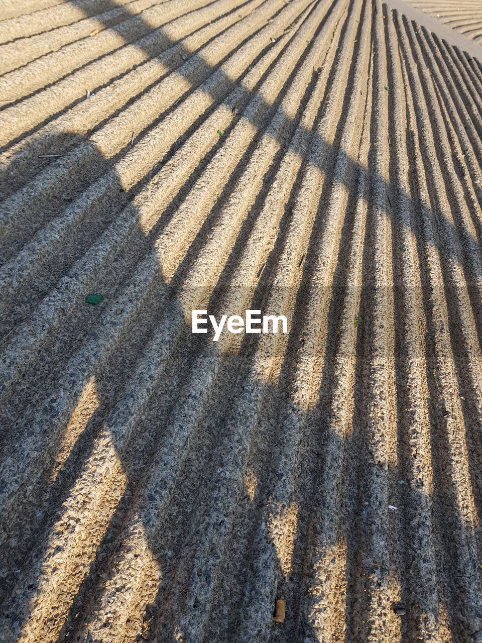 High angle view of shadow on sand