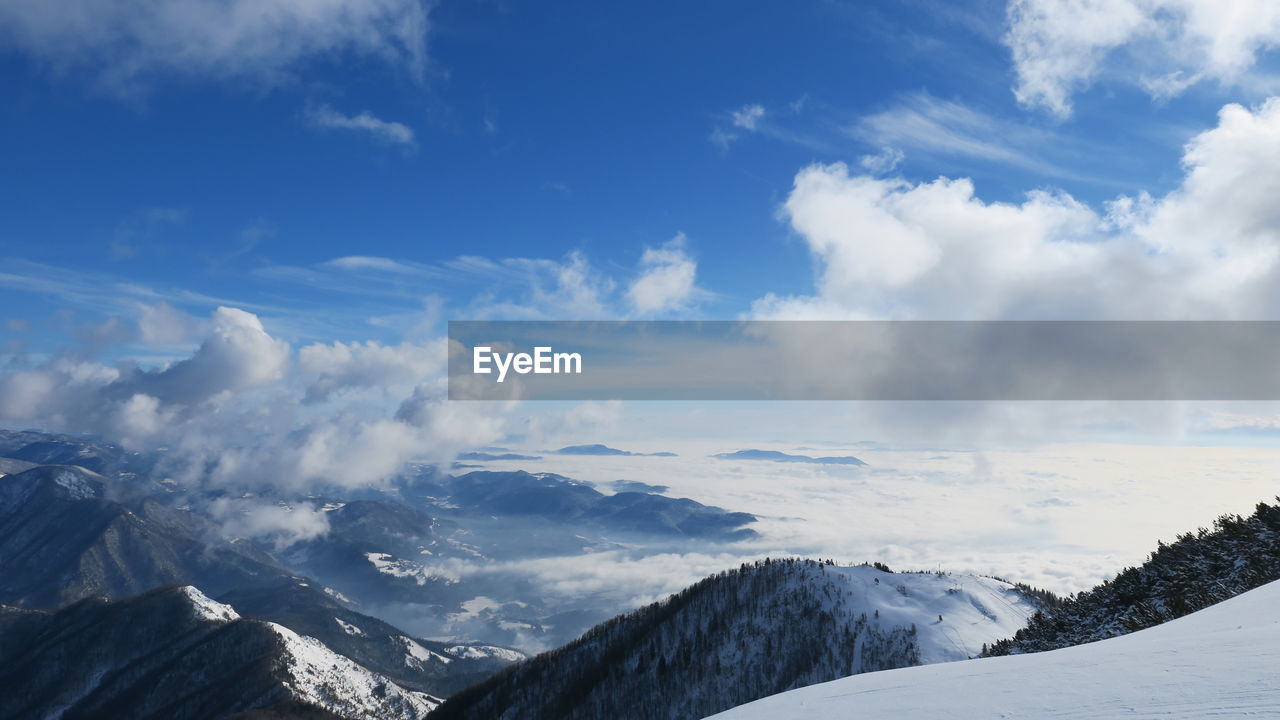 Scenic view of snowcapped mountains against sky