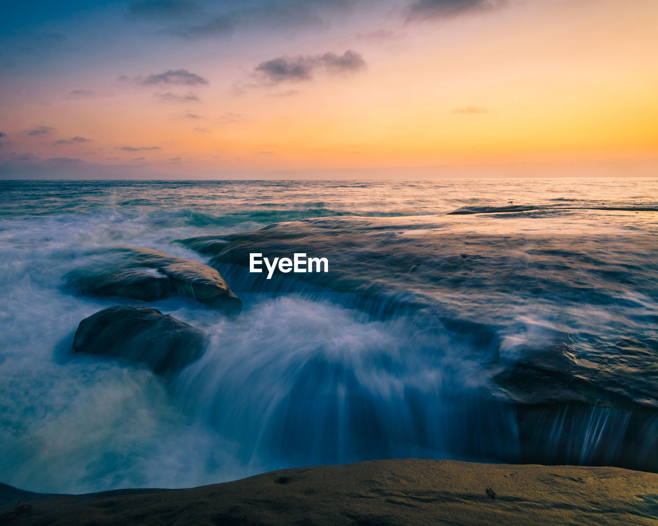 Scenic view of sea against sky during sunset