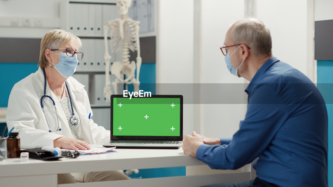 Patient and doctor discussing with each other at clinic