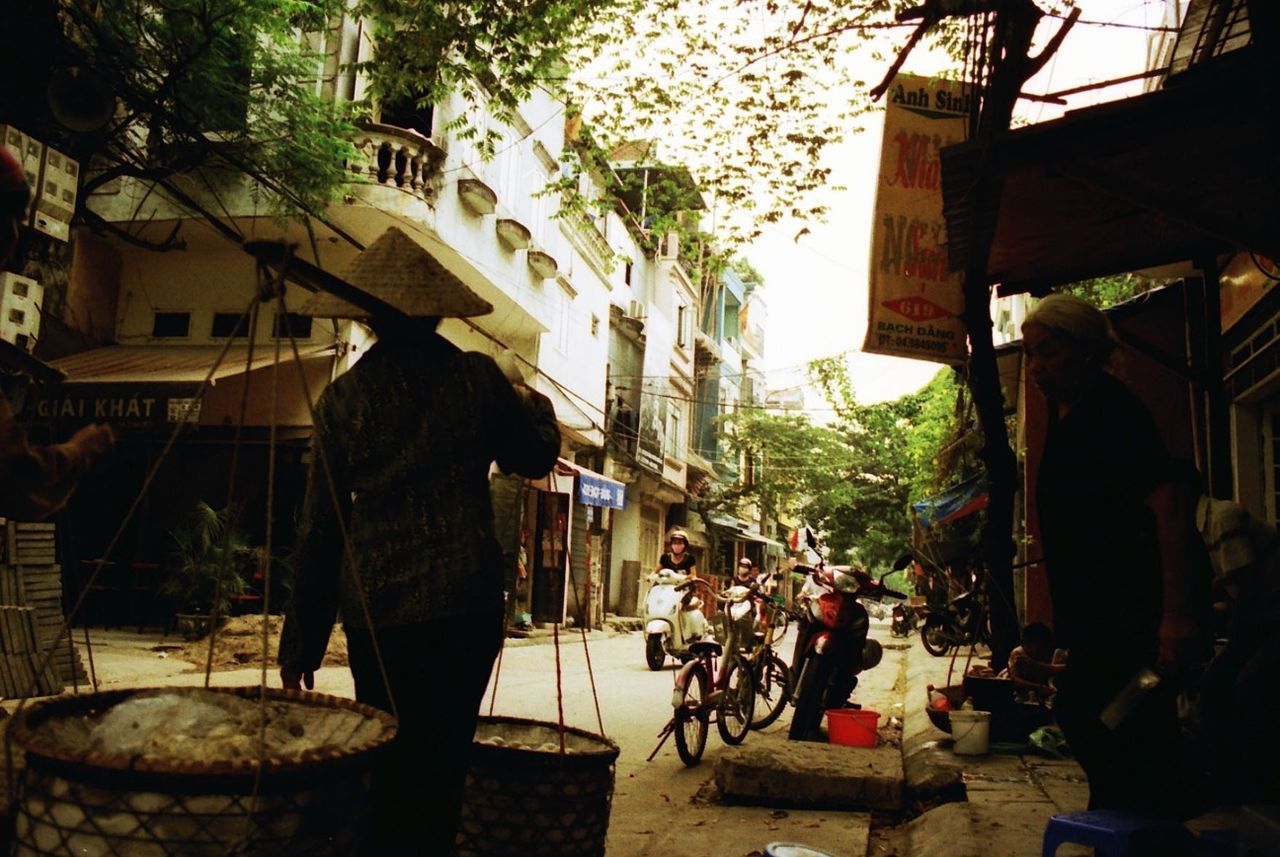 WOMAN WALKING ON CITY STREET