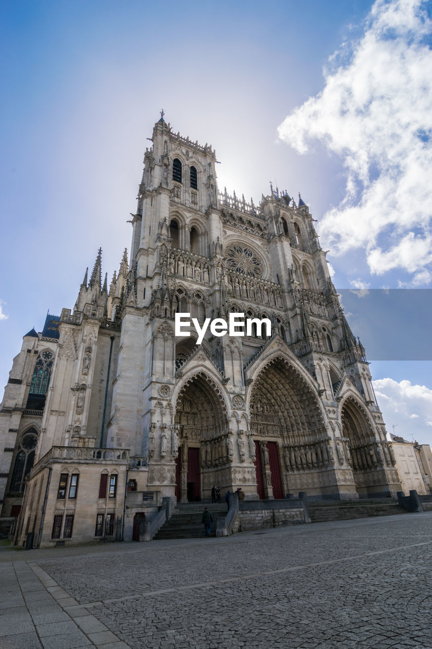Low angle view of the cathedral building in amiens against sky