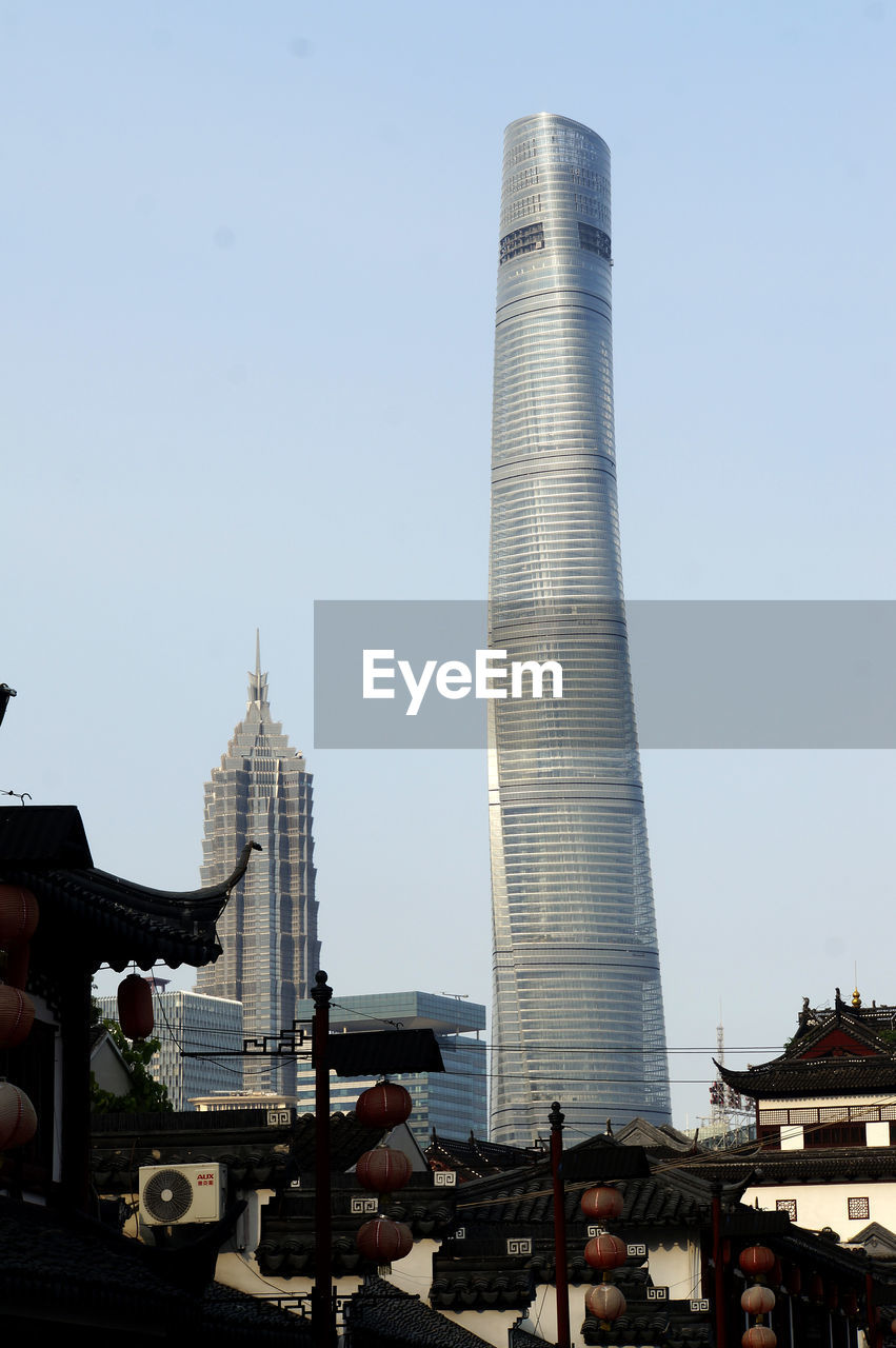 Low angle view of jin mao tower and shanghai tower against clear sky