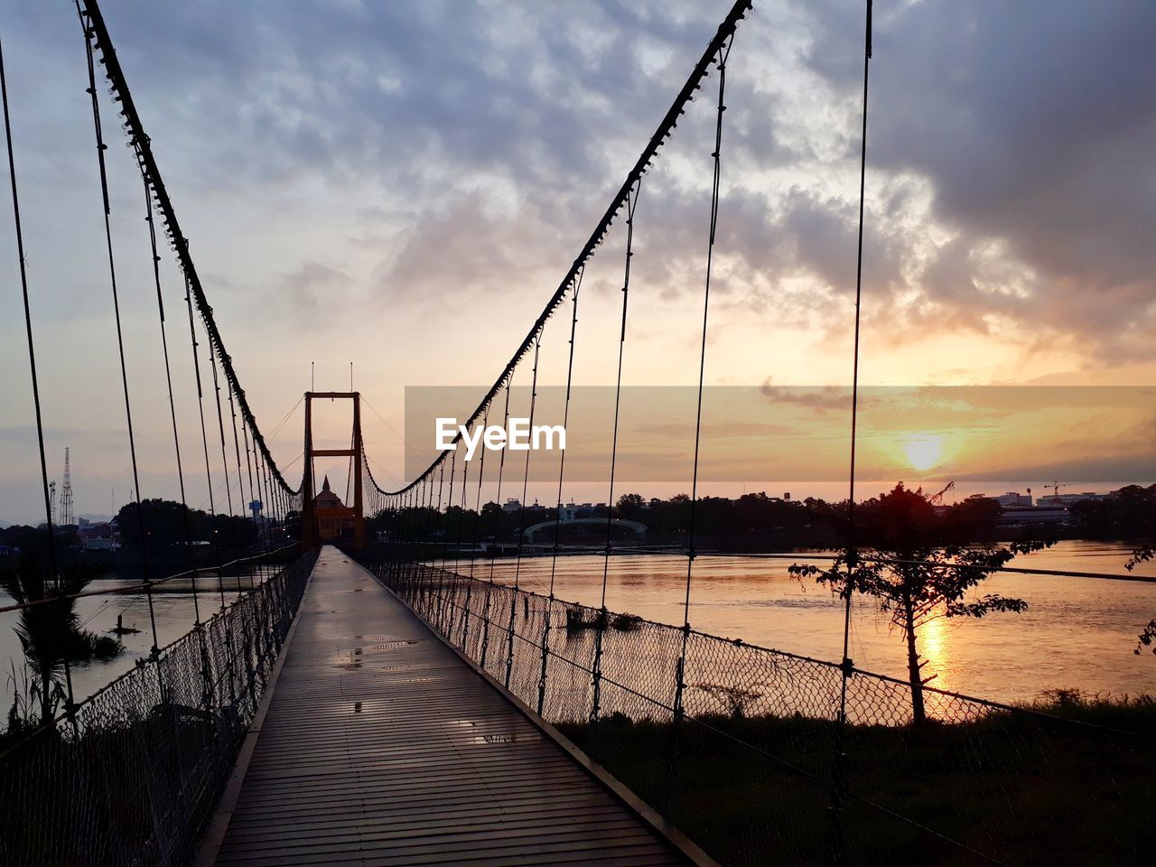 SILHOUETTE OF BRIDGE AGAINST SKY DURING SUNSET