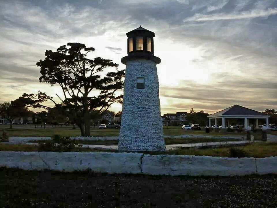 VIEW OF LIGHTHOUSE AGAINST CLOUDY SKY