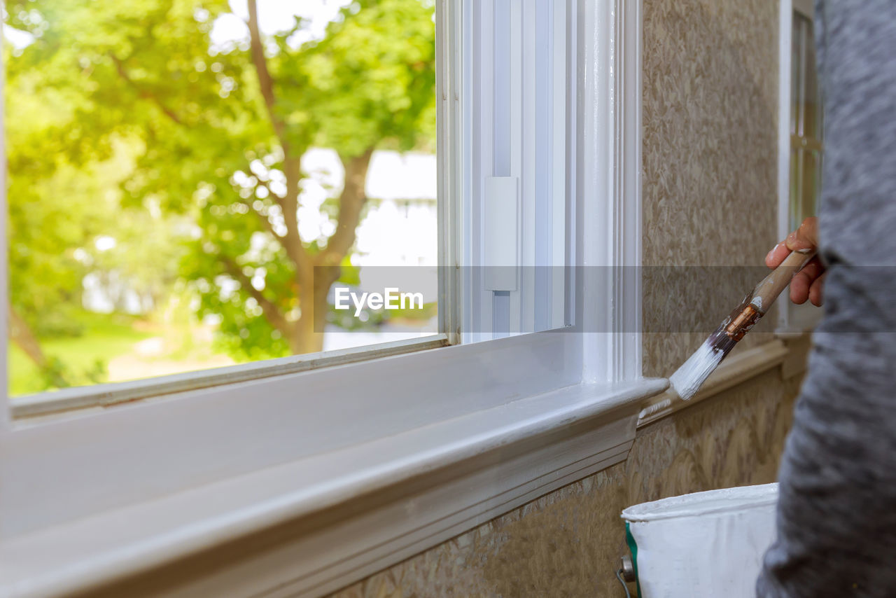 MAN WORKING IN WINDOW