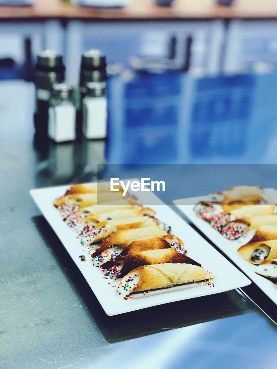 Close-up of dessert served in plates on table