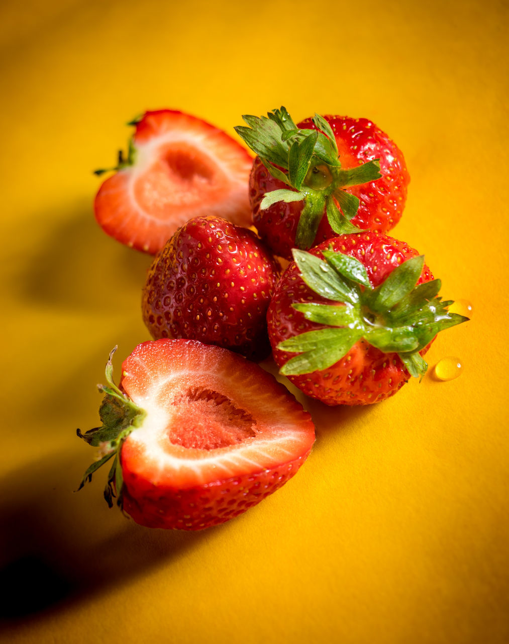 Strawberries on yellow background