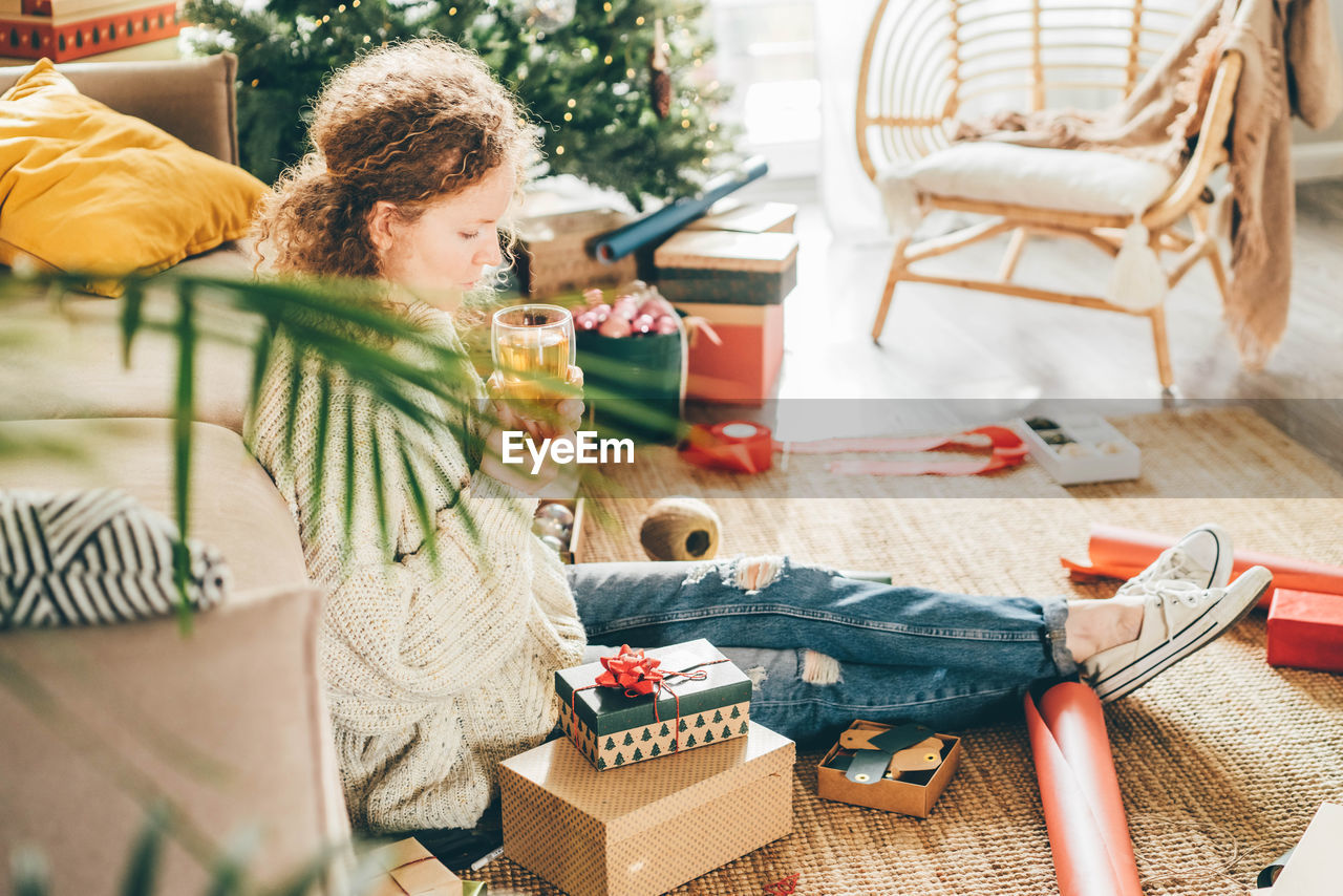 high angle view of girl playing with christmas tree