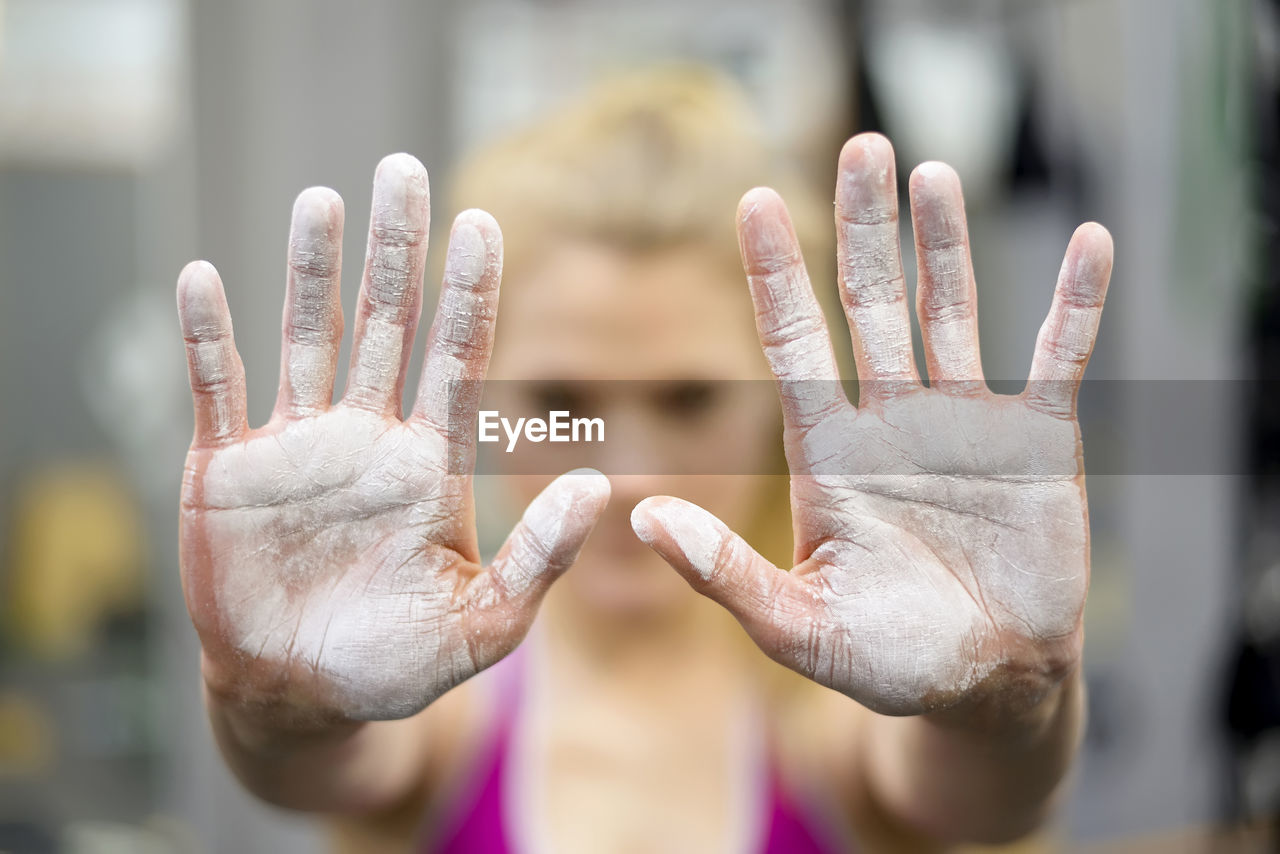 Close-up of human hand against blurred background