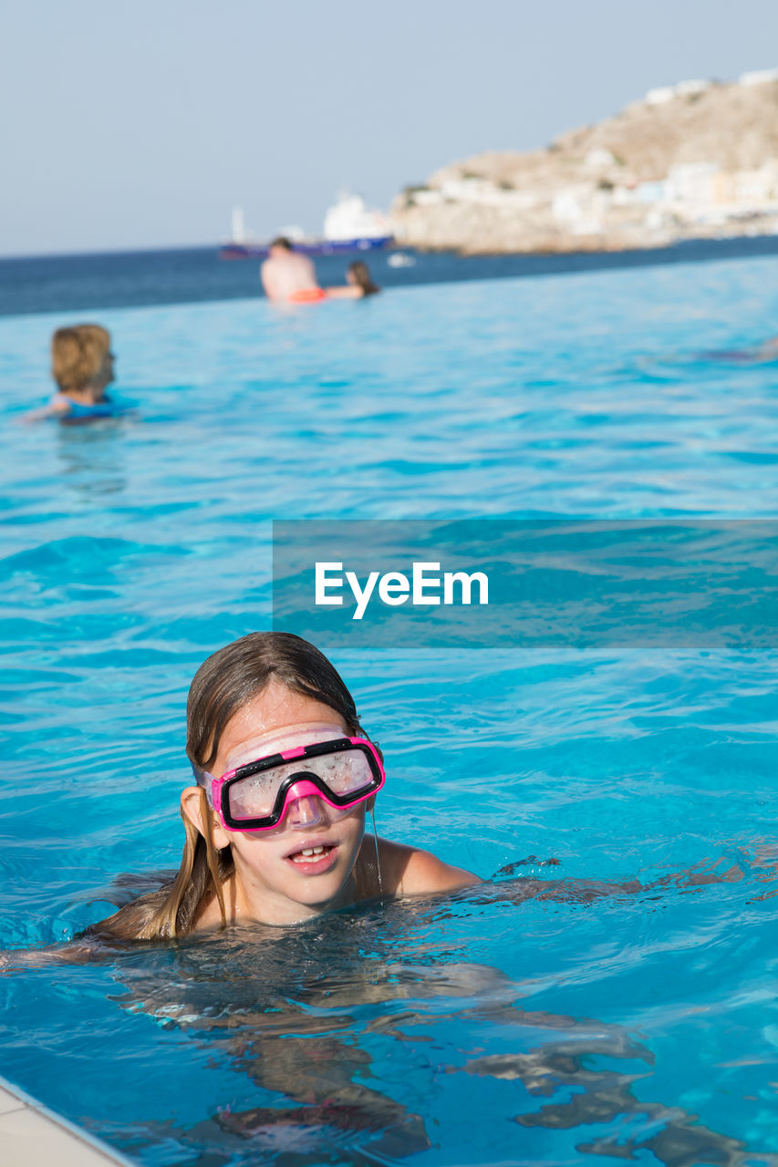 Portrait of girl in infinity pool