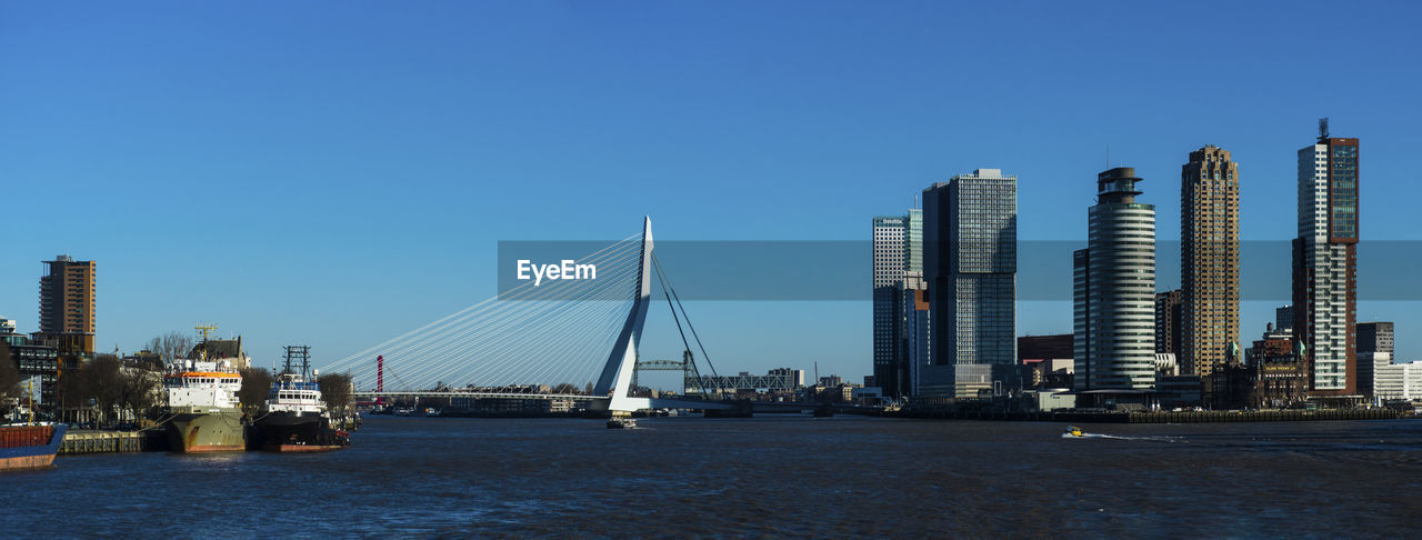 CITY SKYLINE AGAINST CLEAR BLUE SKY