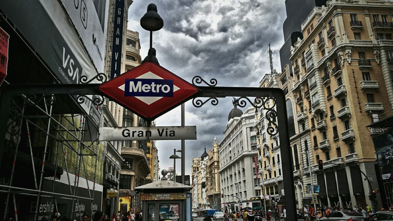 LOW ANGLE VIEW OF CITY STREET AGAINST SKY