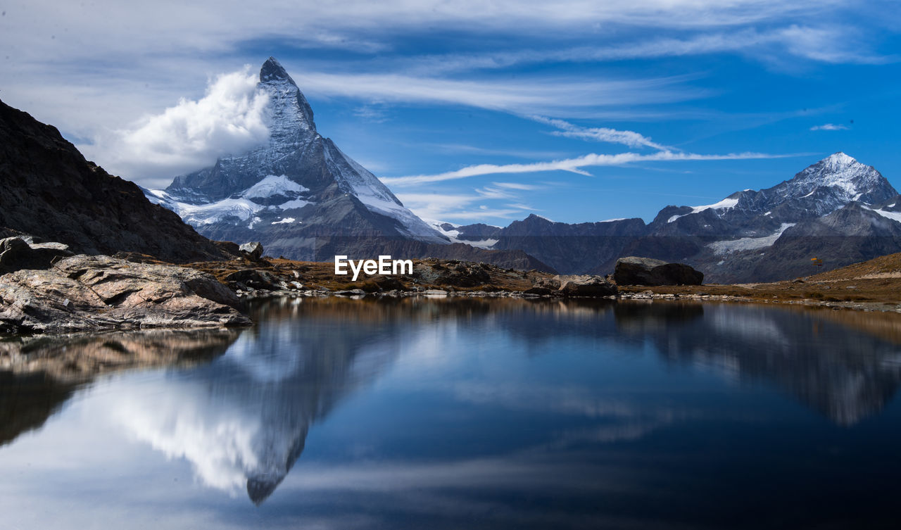 Scenic view of snowcapped mountains against sky