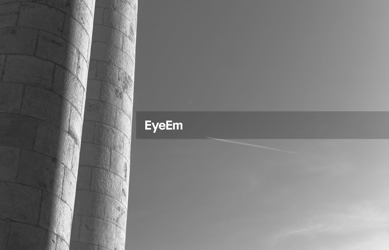 LOW ANGLE VIEW OF VAPOR TRAILS IN SKY