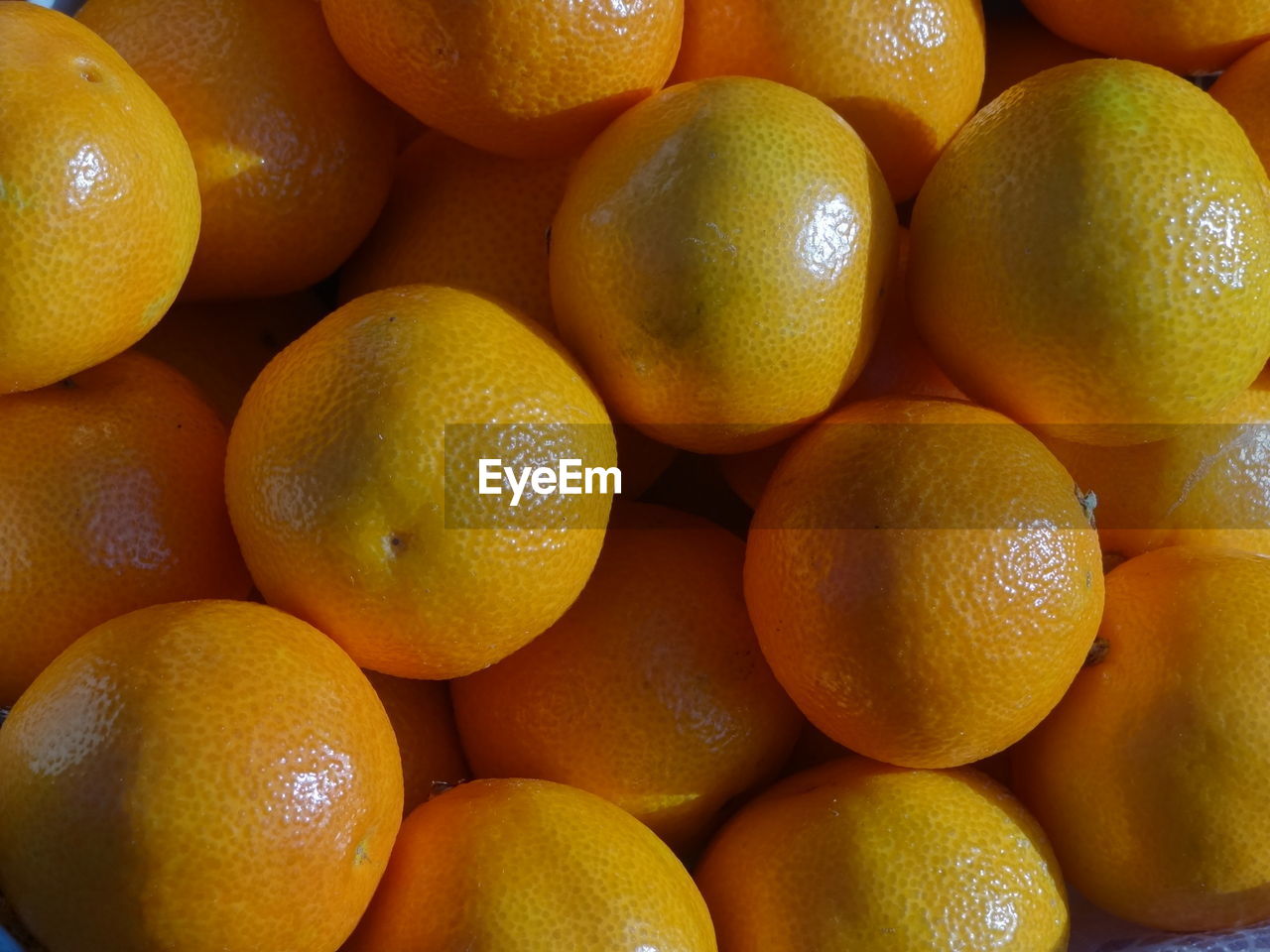 Full frame shot of oranges in market