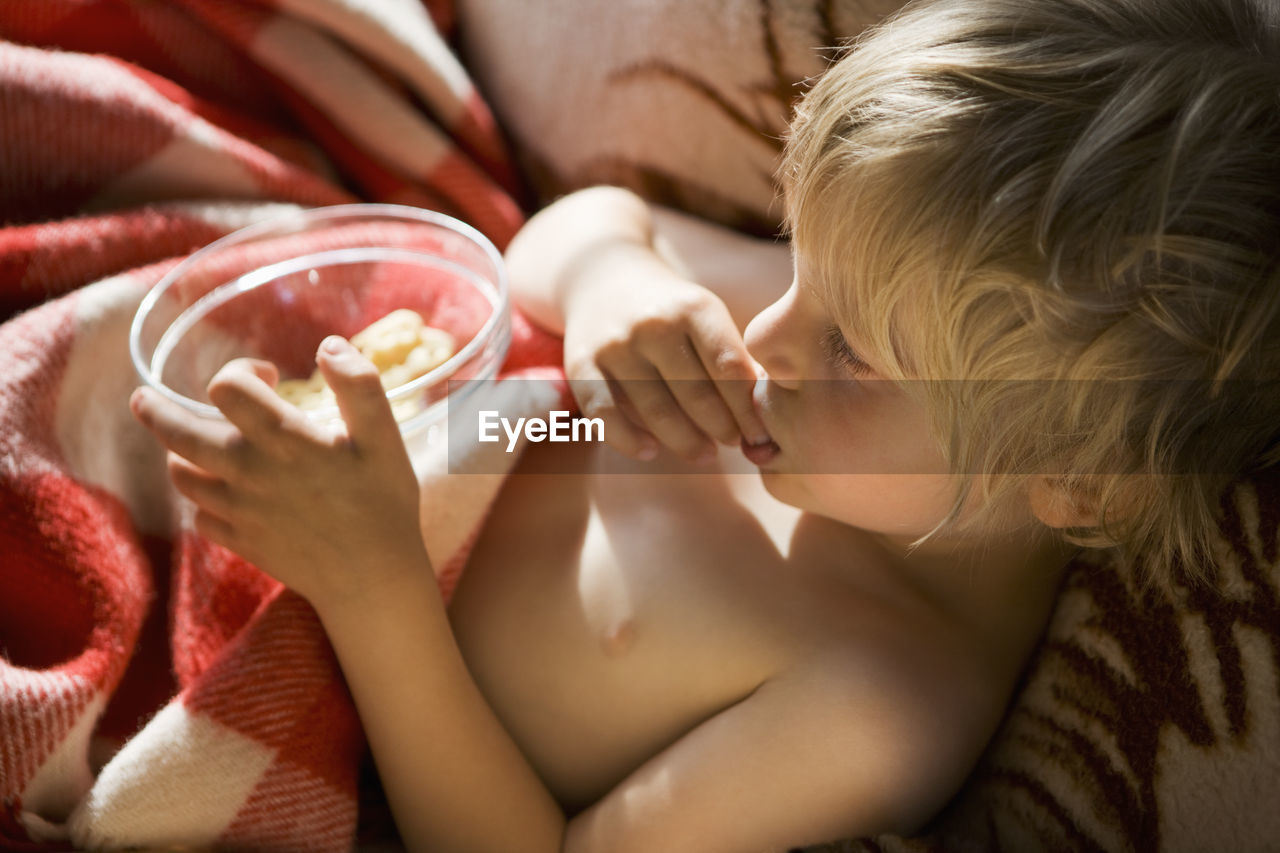 Boy eating snacks, sweden