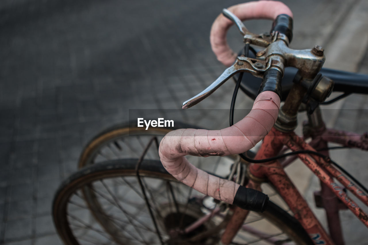 High angle view of bicycle parked on street horn steering vintage 