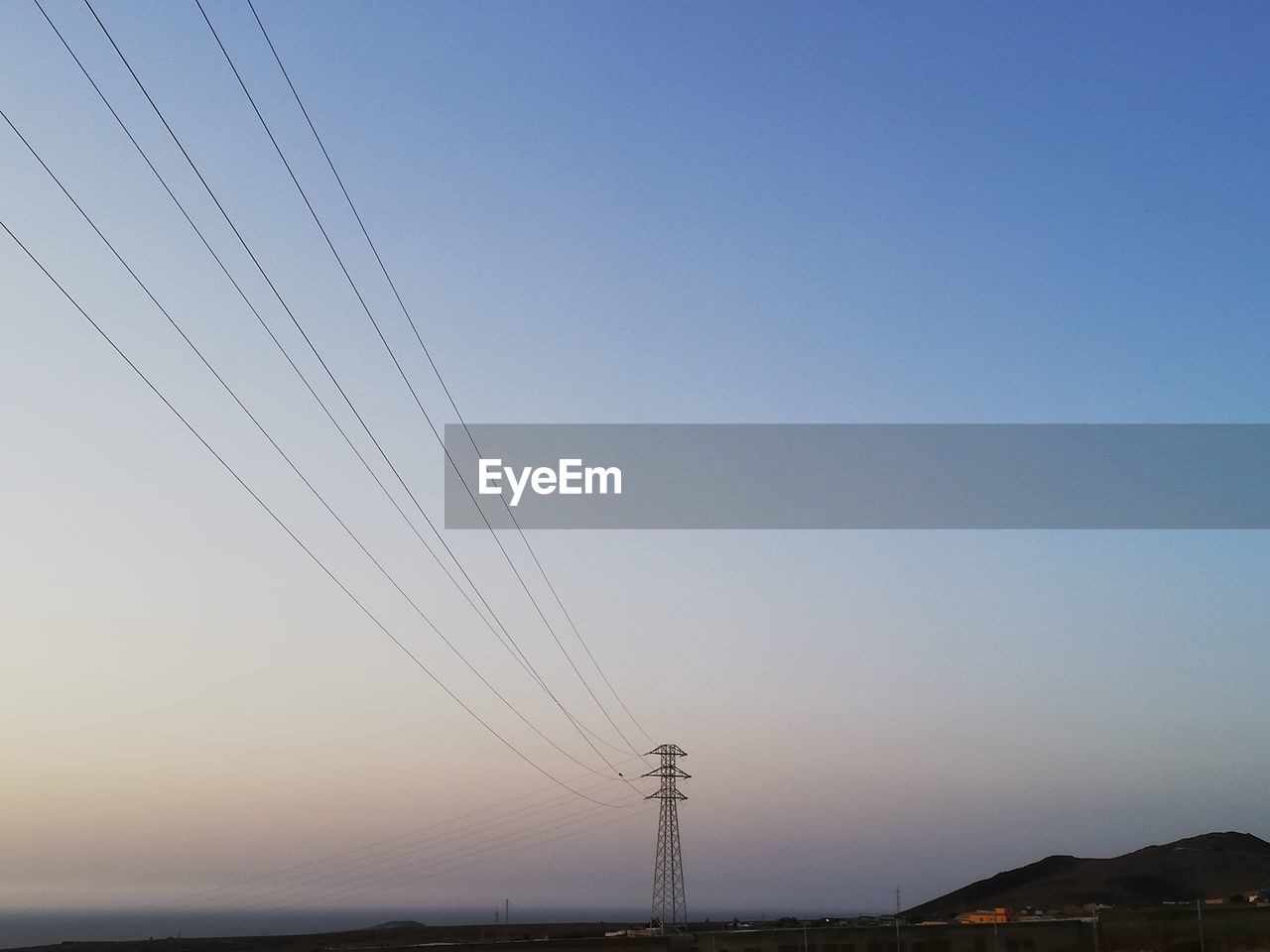 LOW ANGLE VIEW OF ELECTRICITY PYLON AGAINST SKY