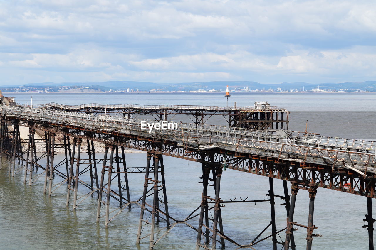 Pier over sea against sky