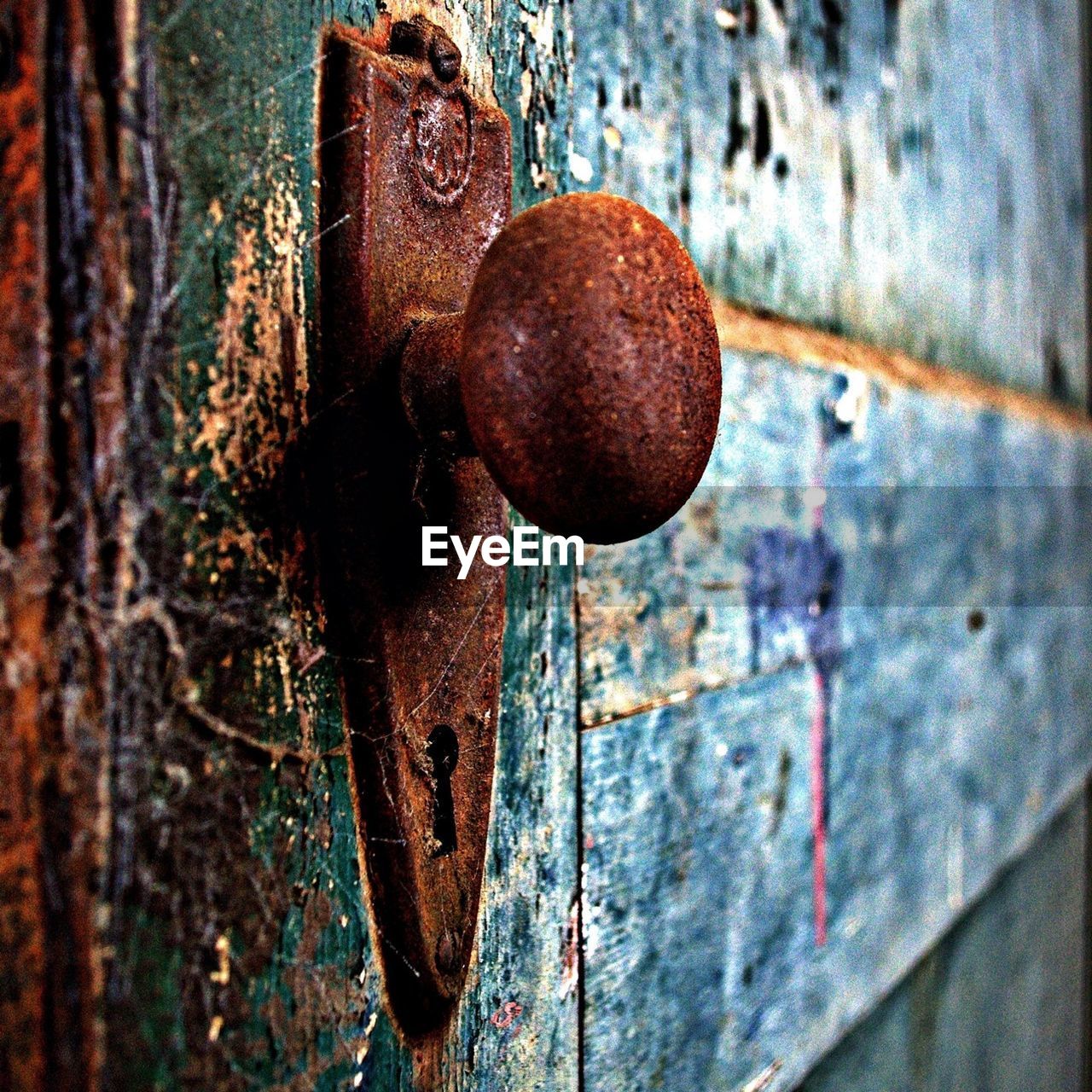 Close-up view of rusty doorknob