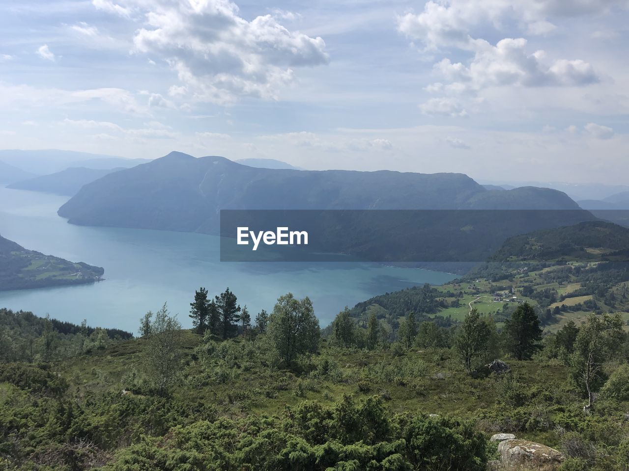 Scenic view of landscape and mountains against sky