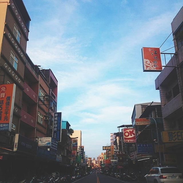 ROAD WITH BUILDINGS IN BACKGROUND