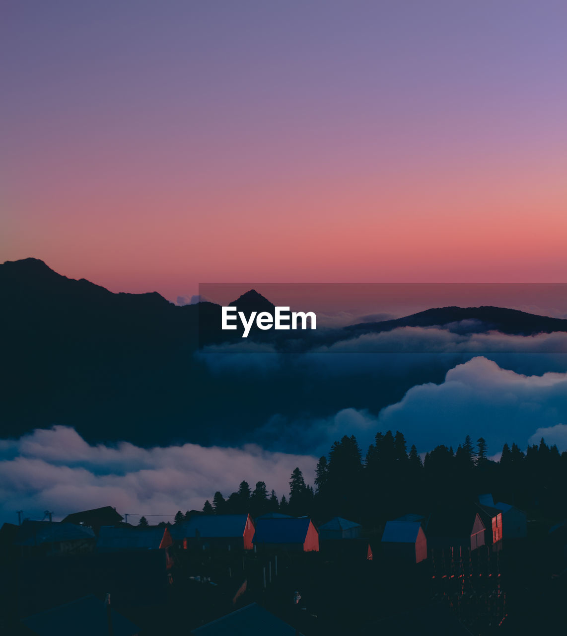 Scenic view of silhouette mountains against sky during sunset