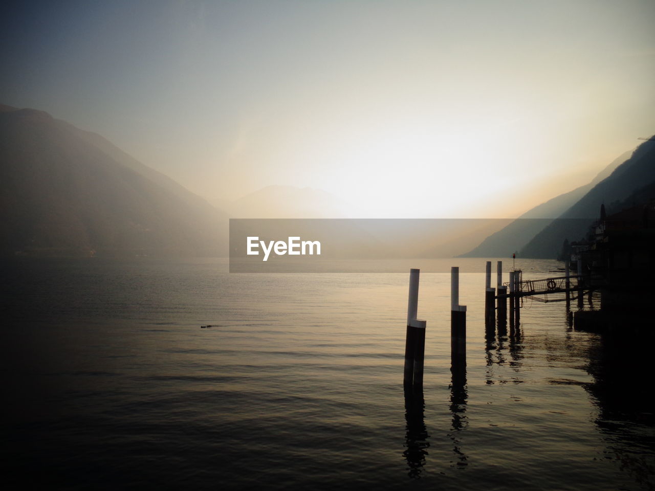 Scenic view of lake against sky during sunset