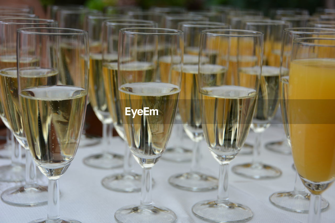 Champagne flutes arranged on table