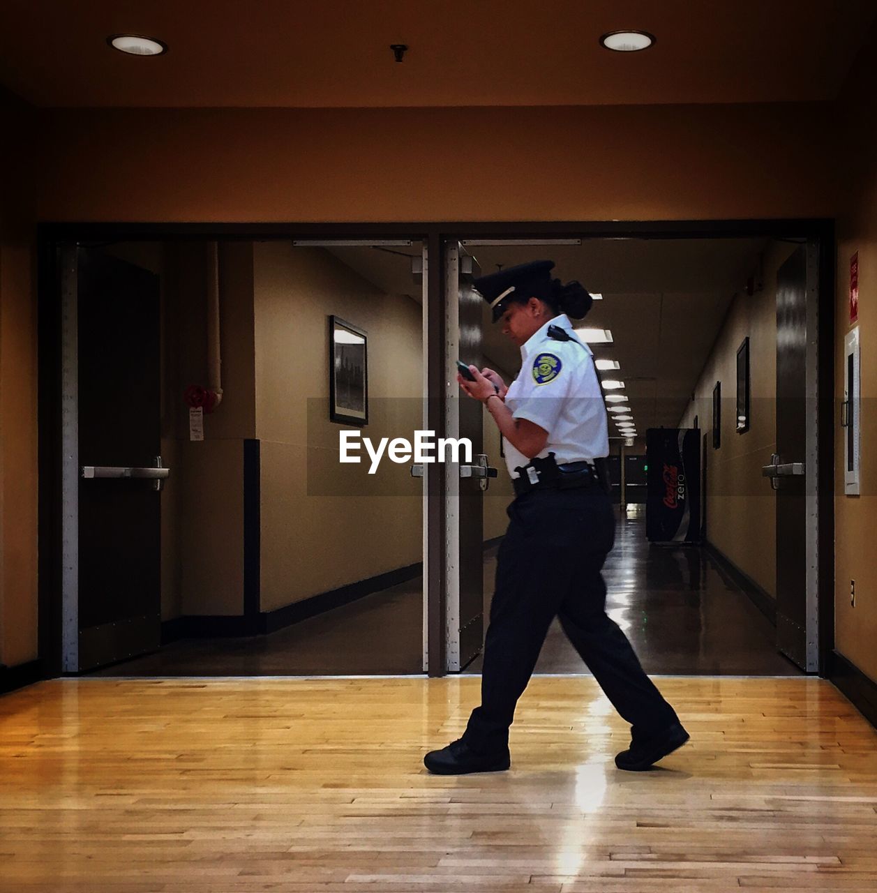 WOMAN STANDING ON FLOOR