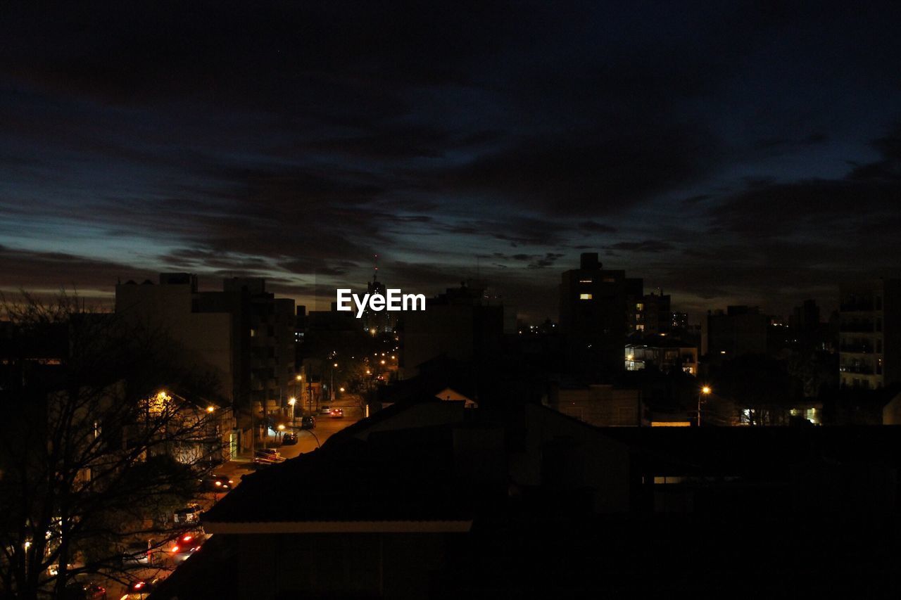 ILLUMINATED CITYSCAPE AT NIGHT