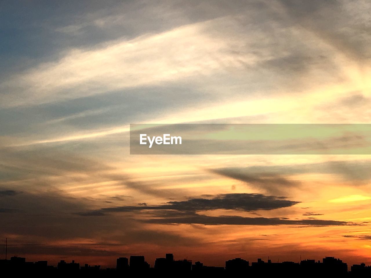 Low angle view of dramatic sky during sunset