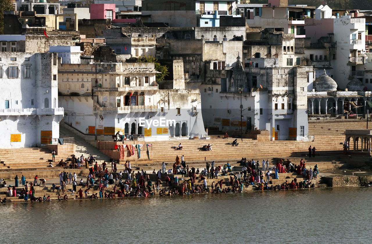 Pilgrims at pushkar lake on sunny day