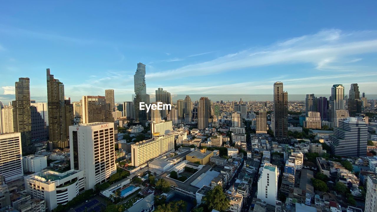 High angle view of modern buildings in city against sky