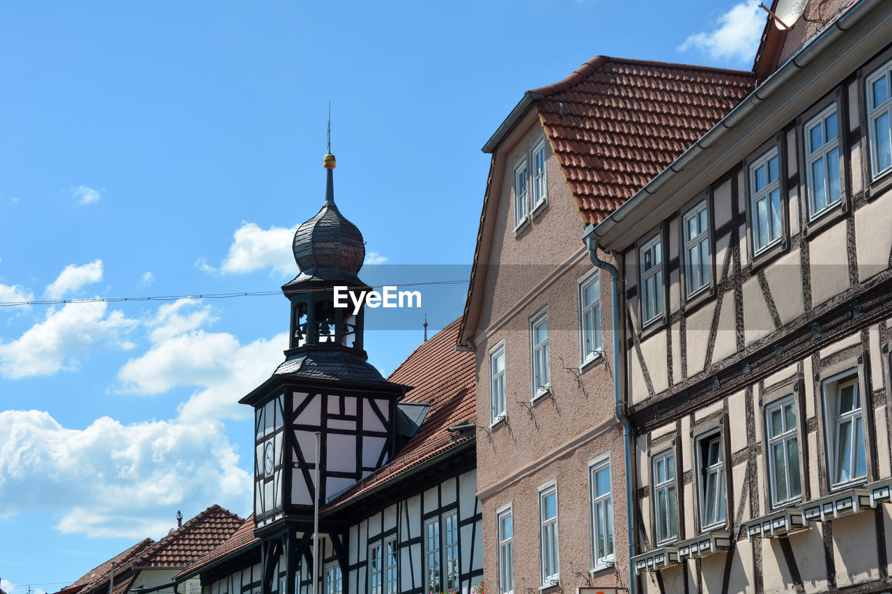 Bell tower from the town hall in ostheim vor der rhoen, bavaria, germany with house facades