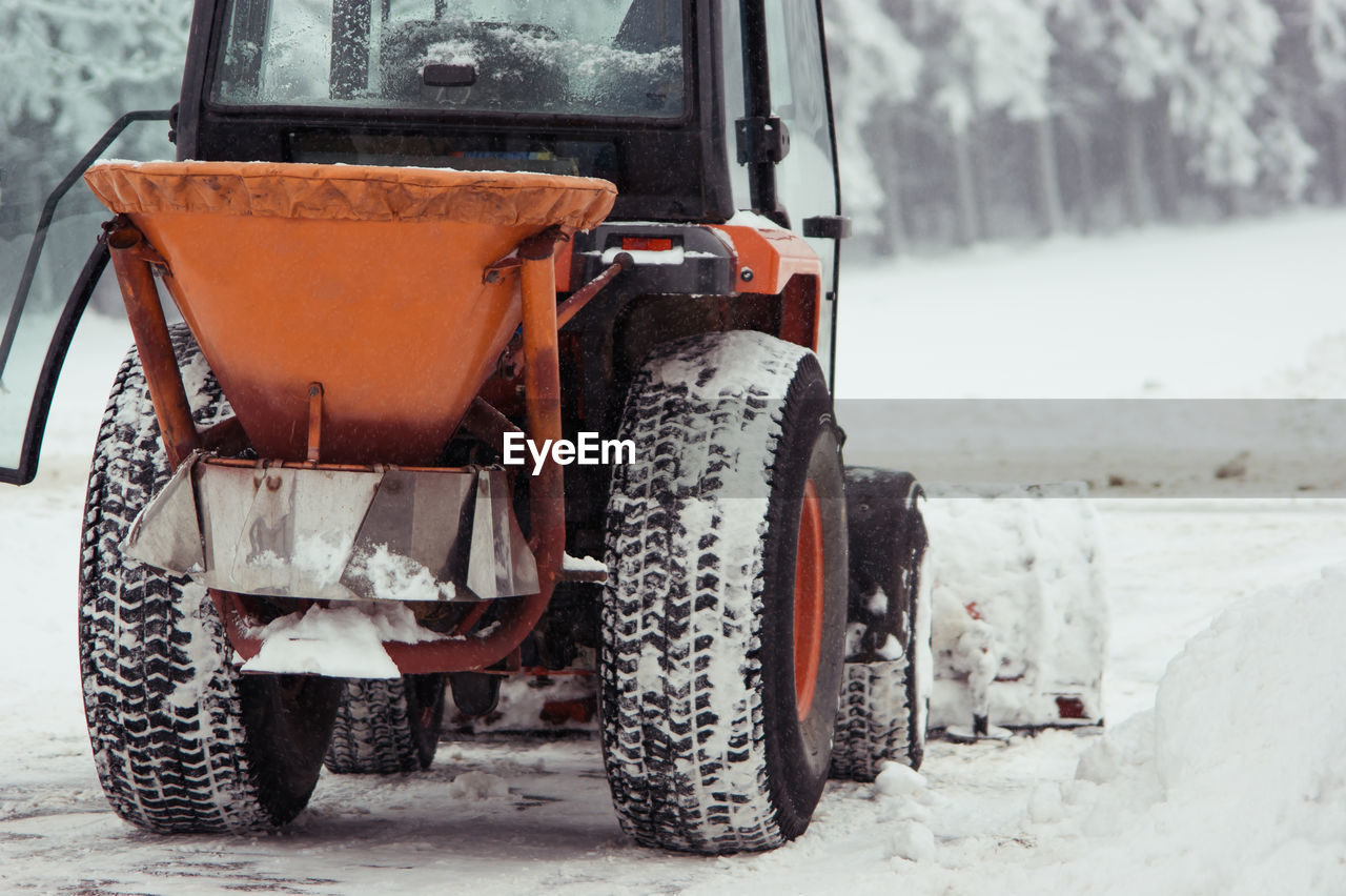 Close-up of earth mover on snow