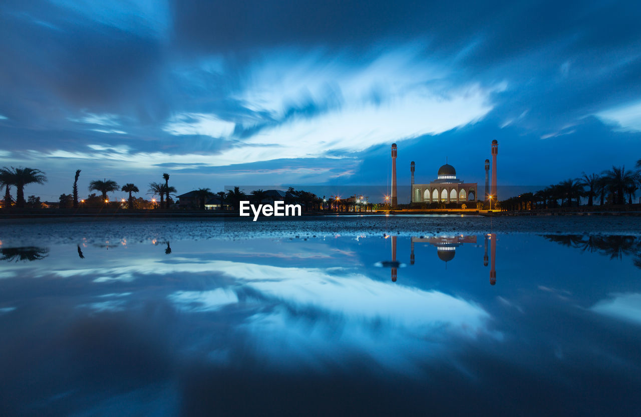 VIEW OF FACTORY AGAINST BLUE SKY